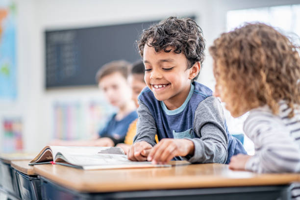 istock Students Reading Together stock photo 1204471418