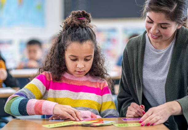 istock Teacher Helping a Student stock photo 1204471427