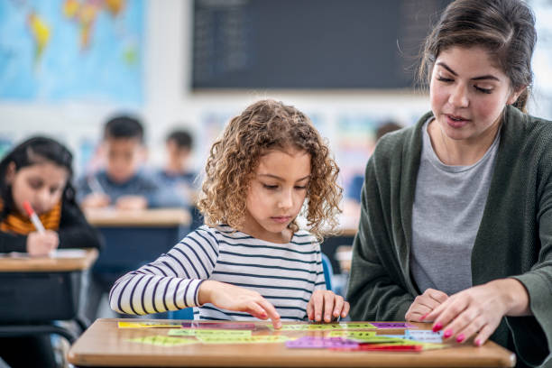 istock Teacher Helping a Student stock photo 1204471434