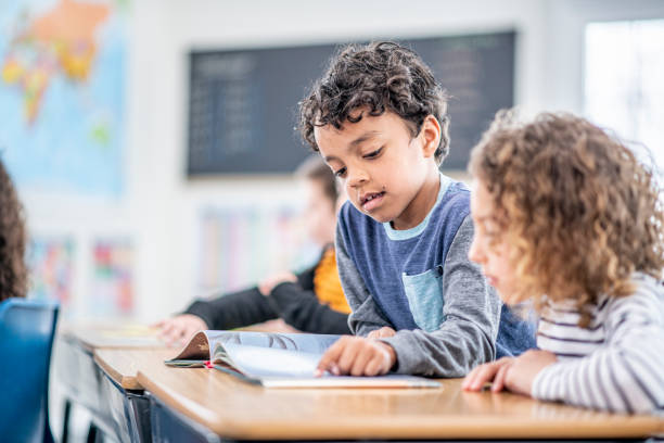 istock Students Reading Together stock photo 1204471436