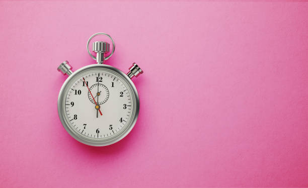 Silver Colored Stopwatch on Hot Pink Background Silver colored stopwatch sitting on hot pink background. Horizontal composition with copy space. timer photos stock pictures, royalty-free photos & images