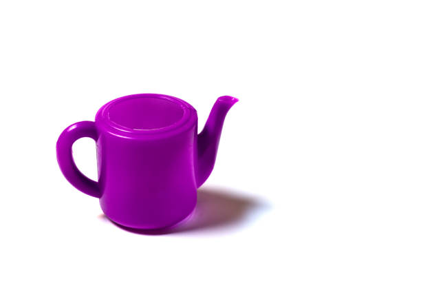 toy plastic kettle purple color isolated children hot drink