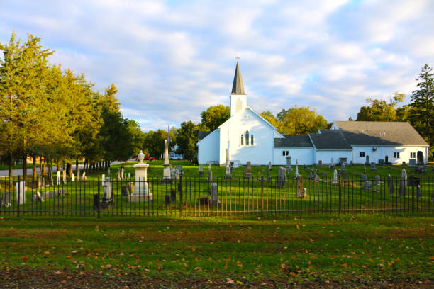 a small town church and cemetery in autumn