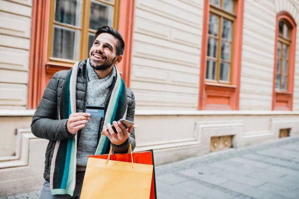 istock Young man in shopping 1204478379