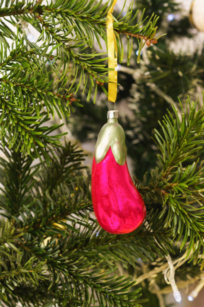 istock Glass red eggplant-new years Soviet Christmas tree toy on a branch 1204480111