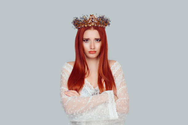 portrait upset beauty queen, woman looking suspicious, disapproval on face arms crossed folded unhappy pretty woman with crystal crown on head isolated on light gray background - beauty queen imagens e fotografias de stock