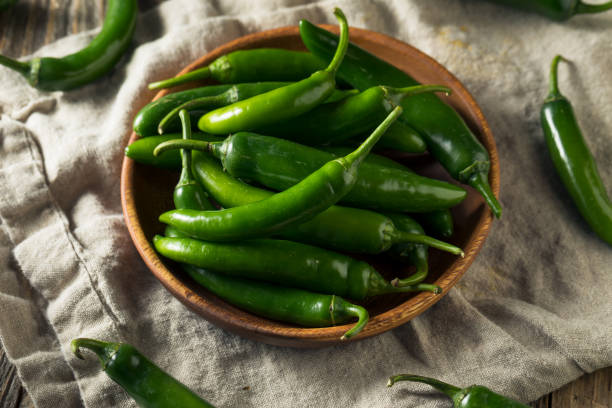 istock Raw Green Organic Serrano Peppers 1204481677
