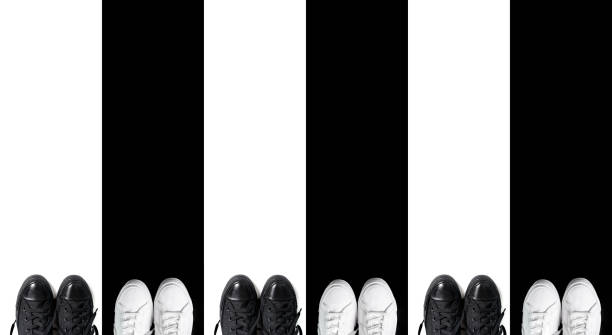 istock Short low white and high black sneakers 1204482763