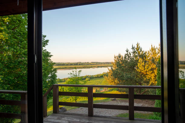 istock View from a patio, a natural ladscape with river. 1204483564
