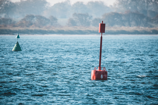 Red marker buoy floating in the sea fehmarn