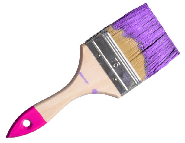 istock Paintbrush with purple paint (isolated on white) 1204485615