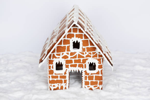 istock The hand-made eatable gingerbread house and snow decoration 1204486916