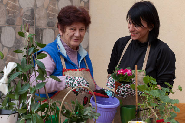 istock elderly lady and young girl 1204488085