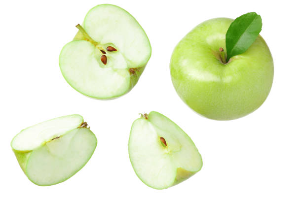 istock green apples with slices isolated on white background. top view 1204488257