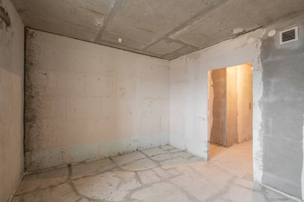 istock Empty interior for design, gray concrete wall. Empty room. Space for text and picture. Concrete walls, slabs, interior of a new residential building. Partitions in a new apartment. 1204488293