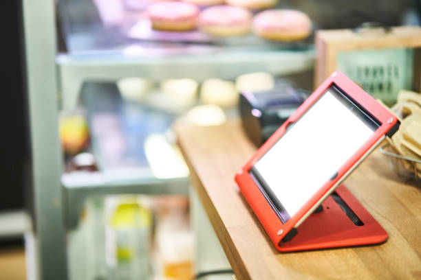 istock Cashier counter. Tablet with CRM system. close-up 1204488394