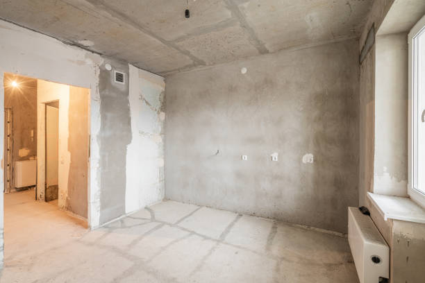 istock Empty interior for design, gray concrete wall. Empty room. Space for text and picture. Concrete walls, slabs, interior of a new residential building. Partitions in a new apartment. 1204488413