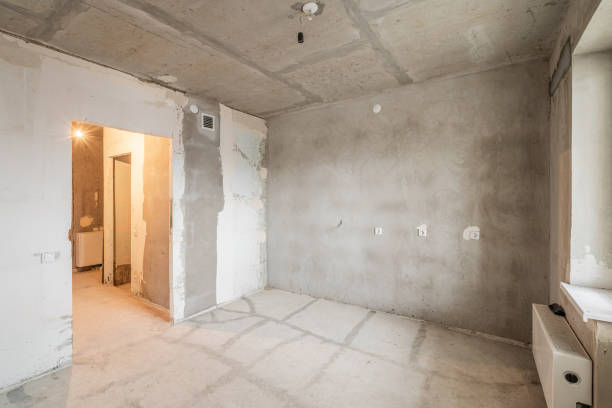 istock Empty interior for design, gray concrete wall. Empty room. Space for text and picture. Concrete walls, slabs, interior of a new residential building. Partitions in a new apartment. 1204488969