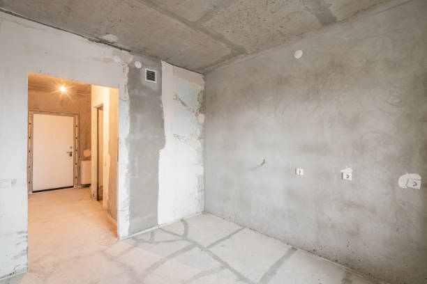 istock Empty interior for design, gray concrete wall. Empty room. Space for text and picture. Concrete walls, slabs, interior of a new residential building. Partitions in a new apartment. 1204489044