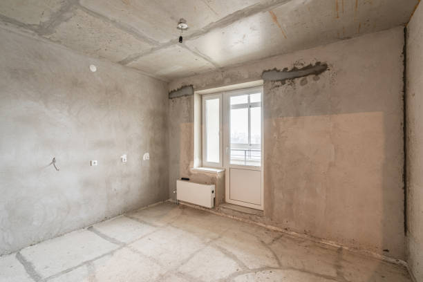 istock Empty interior for design, gray concrete wall. Empty room. Space for text and picture. Concrete walls, slabs, interior of a new residential building. Partitions in a new apartment. 1204489087