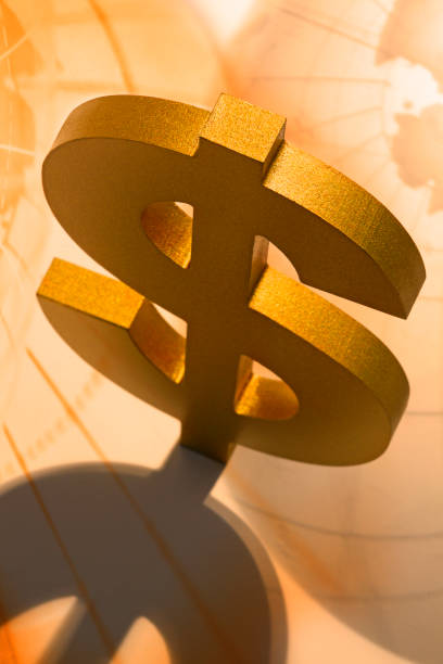 istock Dollar Symbol And Globes 1204489258