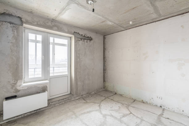 istock Empty interior for design, gray concrete wall. Empty room. Space for text and picture. Concrete walls, slabs, interior of a new residential building. Partitions in a new apartment. 1204489302
