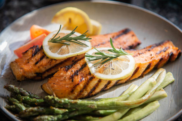 istock grilled salmon fillet on plate with asparagus 1204489651