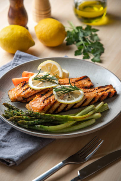 istock grilled salmon fillet on plate with asparagus 1204489675