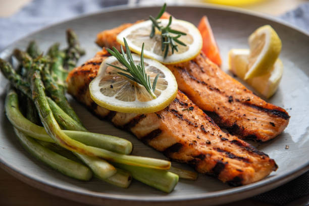 istock grilled salmon fillet on plate with asparagus 1204489700