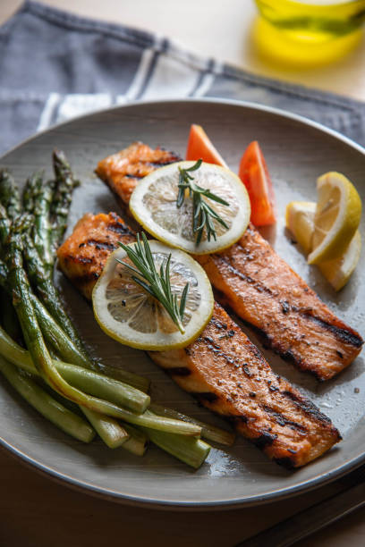 istock grilled salmon fillet on plate with asparagus 1204490263