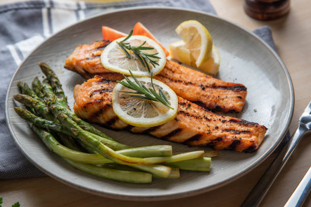 istock grilled salmon fillet on plate with asparagus 1204490372