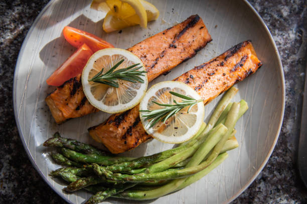 istock grilled salmon fillet on plate with asparagus 1204490420