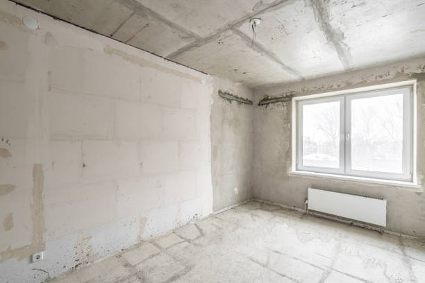 istock Empty interior for design, gray concrete wall. Empty room. Space for text and picture. Concrete walls, slabs, interior of a new residential building. Partitions in a new apartment. 1204490580