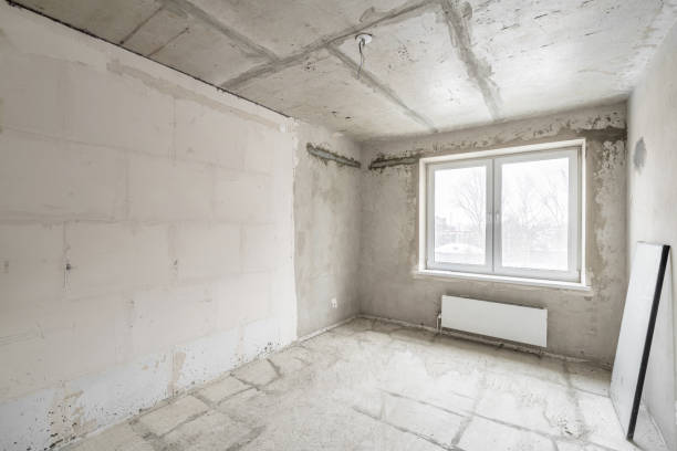 istock Empty interior for design, gray concrete wall. Empty room. Space for text and picture. Concrete walls, slabs, interior of a new residential building. Partitions in a new apartment. 1204490603