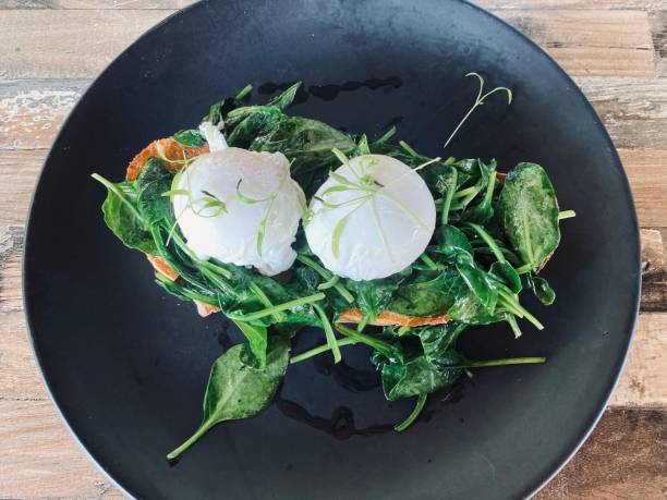 Poached Eggs with Sauted Baby Spinach on Sourdough Toast Breakfast