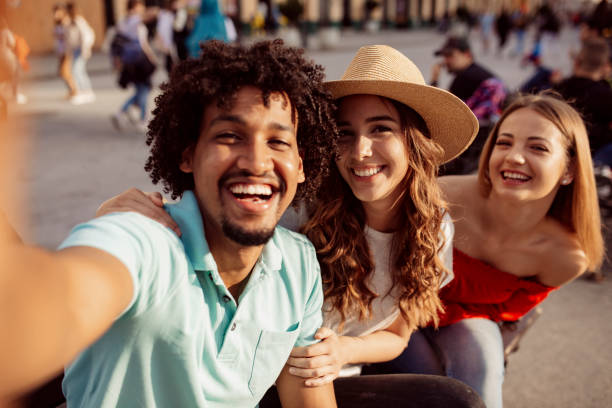 istock Small group of young people taking a selfie 1204491567
