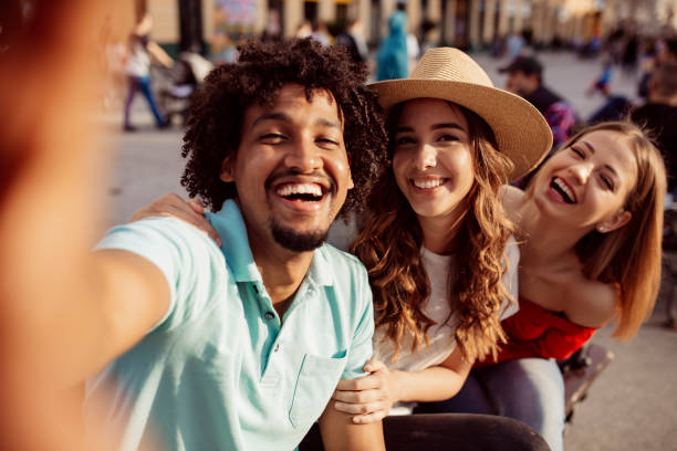 istock Small group of young people taking a selfie 1204491604