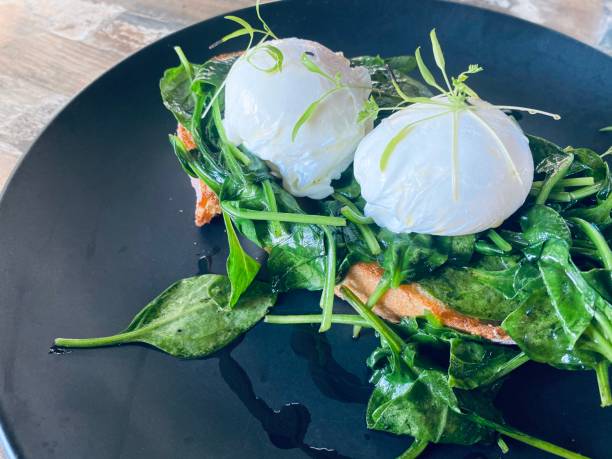 Poached Eggs with Sauted Baby Spinach on Sourdough Toast Breakfast