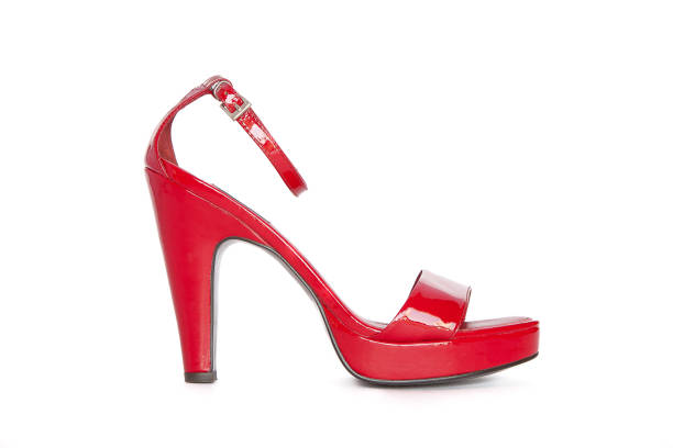 istock Red high-heeled women's shoe on a white background 1204494556