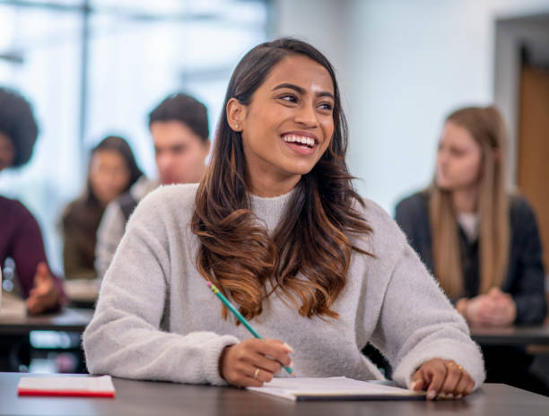 istock Female Indian University Student Writing stock photo 1204496821