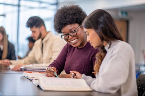 istock Female University Students in Class stock photo 1204496836