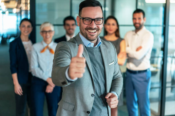 istock Team leader with his team behind 1204501299