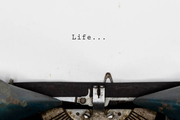 istock About life. With text retro style on old typewriter concept. 1204503310