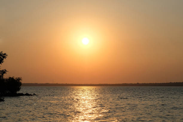 istock Sunset on the background of the river 1204505546