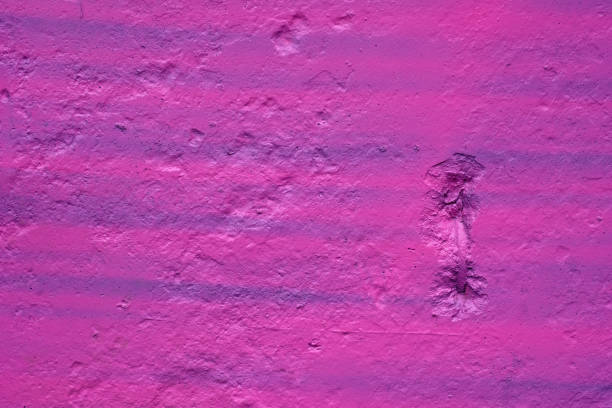 istock texture of a painted wall. cement plate pink color background. 1204505688