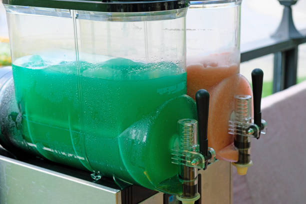 istock Green slush ice drink container, outdoors in summer. 1204505735