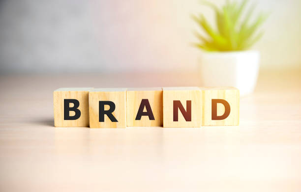 istock BRAND word made with building blocks on sun shine background. 1204505886