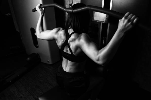 Beautiful Woman Doing Heavy Weight Exercise For Back