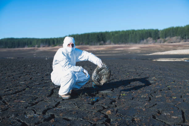 istock Scientist In Protective Clothing Holding Plastic 1204507652