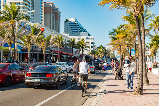 In Fort Lauderdale, United States during Spring Break the beach front road, A1A is crowded with traffic and pedestrians.